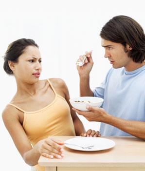 man feeding his girlfriend